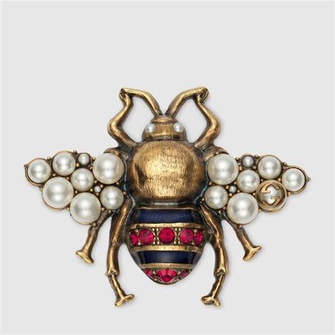 gucci men brooch.